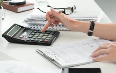 Close up of female accountant or banker making calculations.