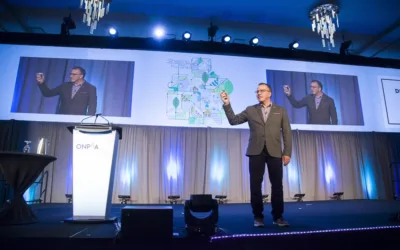 Ron Tite speaking on stage