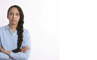 Woman looking frustrated with crossed arms