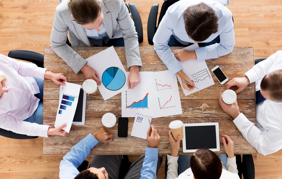 business, people, statistics and team work concept - close up of creative team