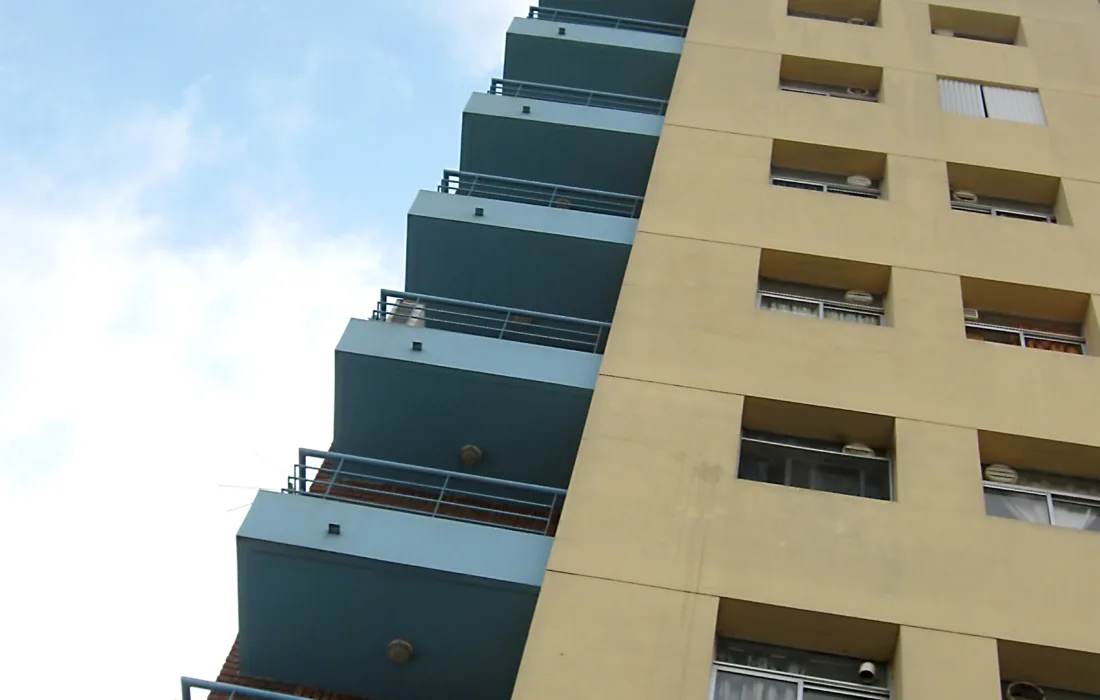 Apartment building against blue sky