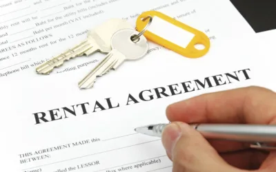 Close up of hand singing rental agreement
