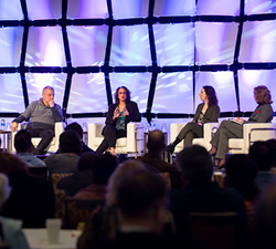 A panel of four people in discussion onstage at the 2019 ONPHA Conference
