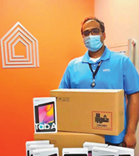 LOFT staff with tablets used for virtual support