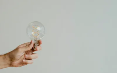 Photo of a person holding a light bulb