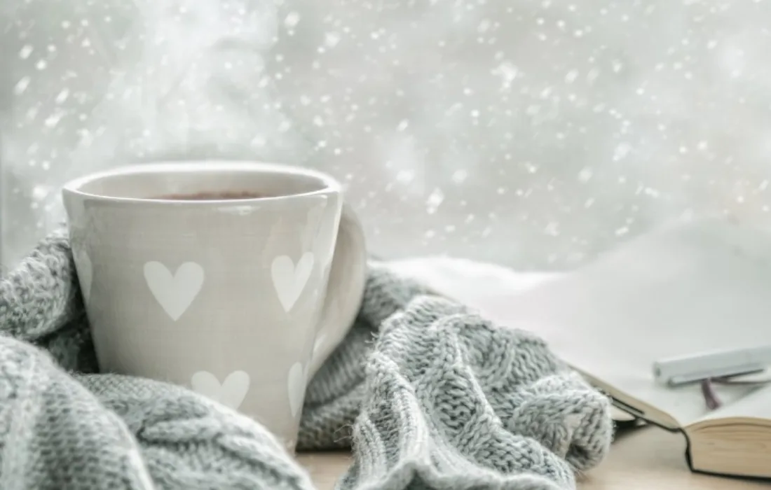 Mug on table with blanket