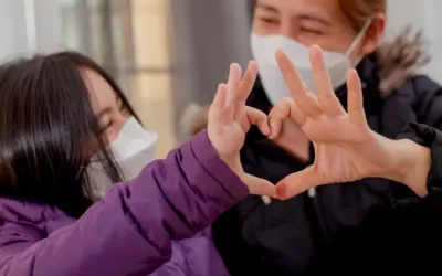 Woman and daughter wearing facemasks