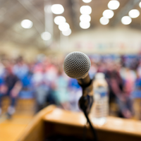 Microphone facing a room of people