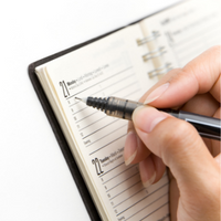 Pen writing inside of an agenda