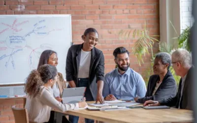 A group of coworkers gathered around a table