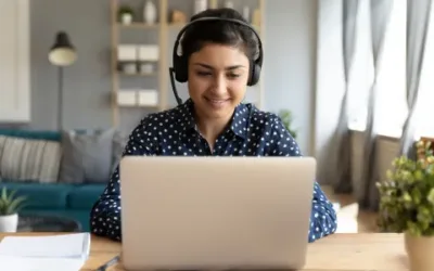 A young person watching a webinar from their laptop