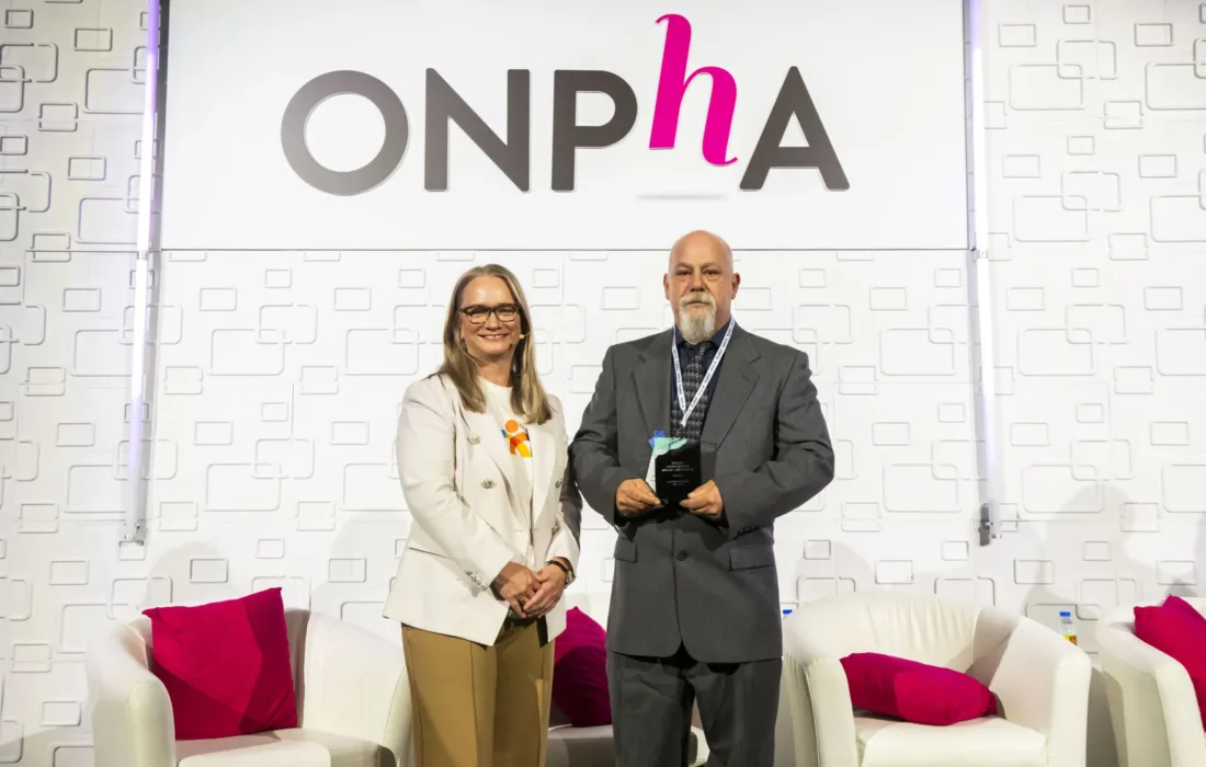 2024 ONPHA Tenant Achievement Award Winner on stage at the ONPHA Conference