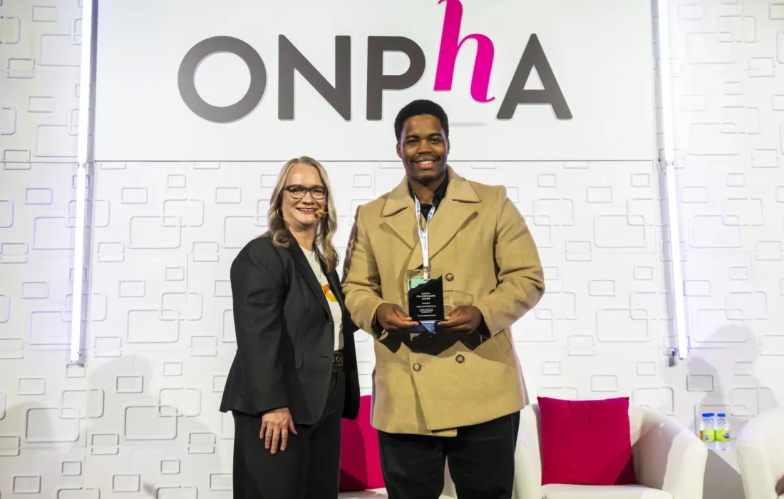 2024 ONPHA Young Changemaker Award Winner on stage at the ONPHA Conference