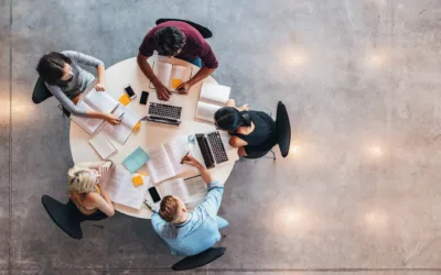 Top view of group of people sitting together at table.