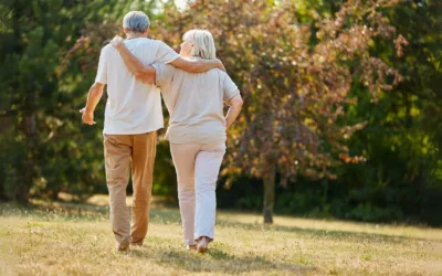Two seniors walking outside
