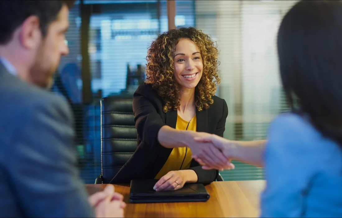 Two women shaking hands after a job interview