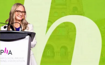 Marlene Coffey, ONPHA CEO, speaking at a podium