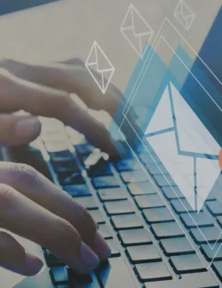 Hands typing out an email