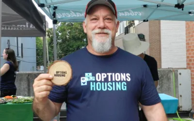 Photo of Gaston Brisson, tenant at Options Housing, at a summer bbq
