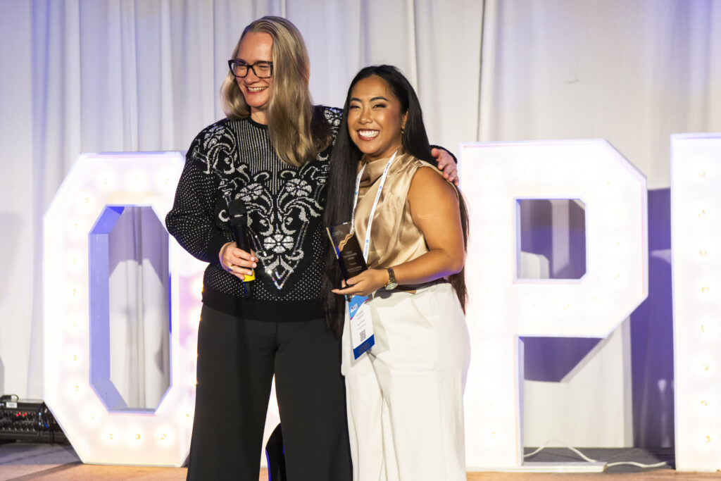 Woman receiving an award on stage