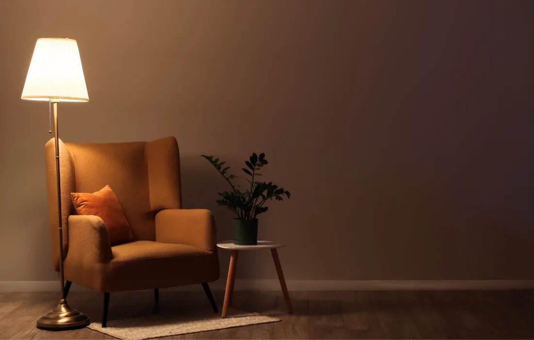 Lamp turned on inside of a living room