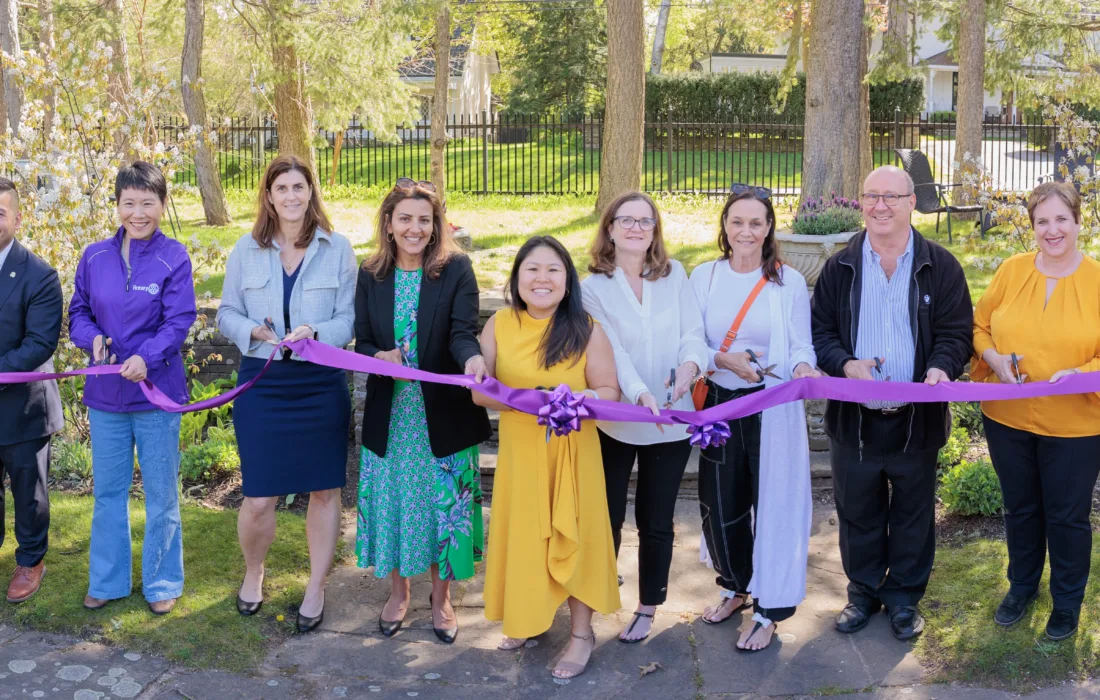 The team at Armagh house cutting the ribbon of their new location