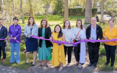 The team at Armagh house cutting the ribbon of their new location