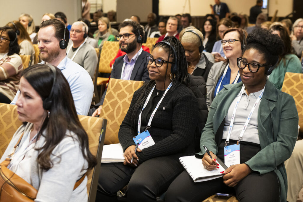 Delegates of the 2025 ONPHA Conference listening live to the Opening Doors Podcast Episode