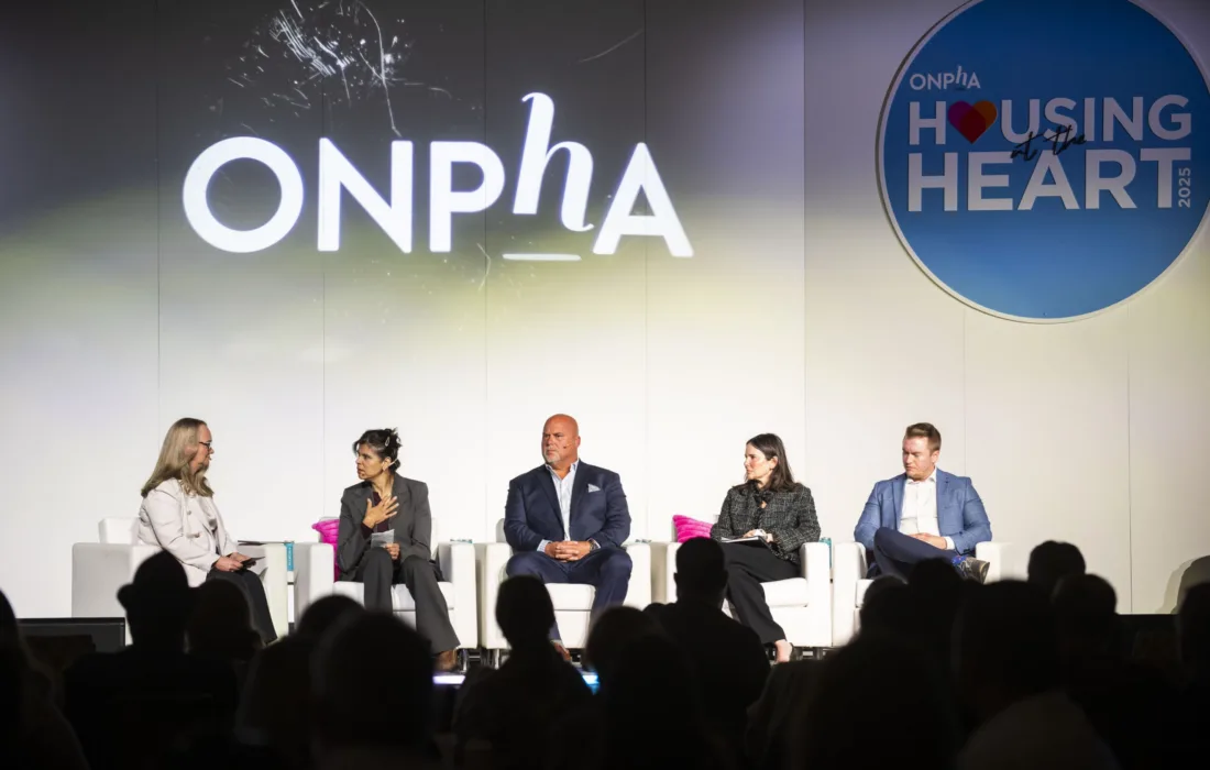ONPHA Conference speakers on stage at a plenary talking about the intersection of housing and health