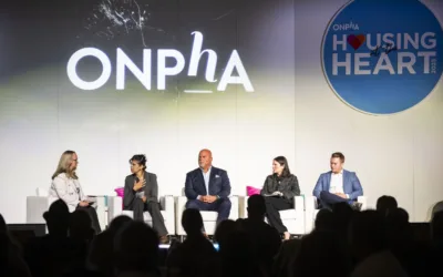 ONPHA Conference speakers on stage at a plenary talking about the intersection of housing and health